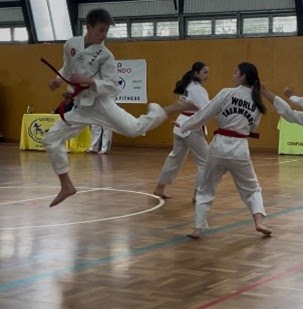 Jakob performing an advanced jumping kick at World Taekwondo